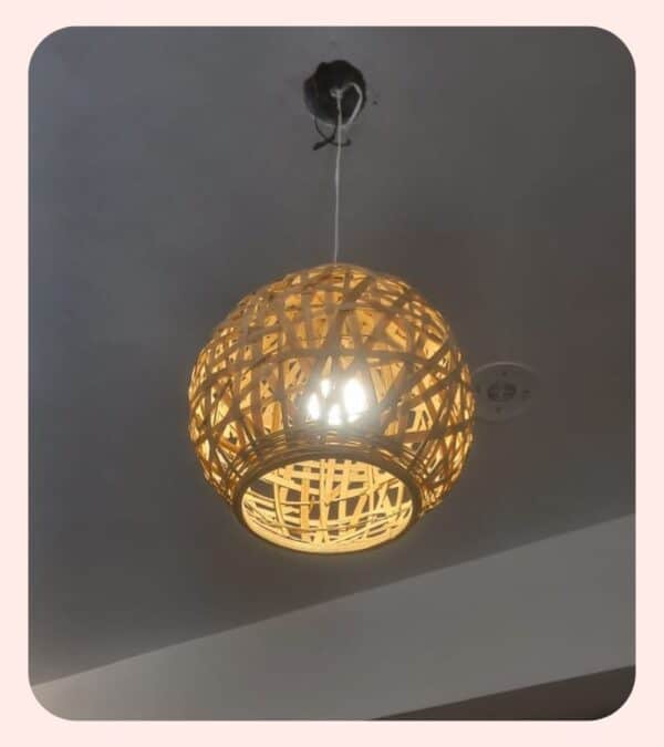 Warm woven rattan pendant light for modern interior decor.