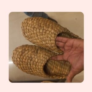 Handwoven straw slippers showcasing traditional craftsmanship at SwiftPe. Perfect for sustainable footwear options.